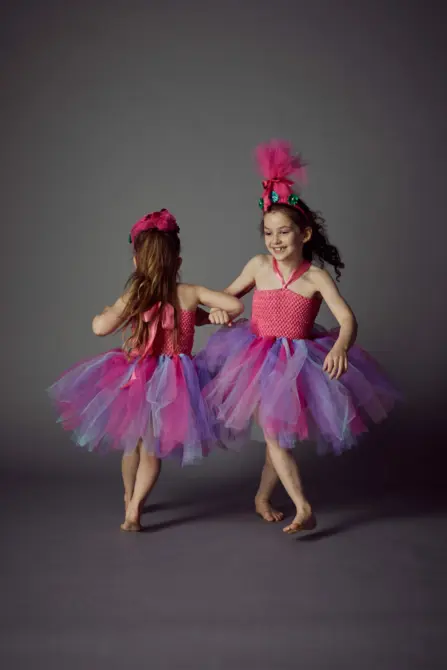 two children dancing together and having fun