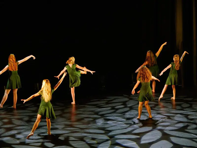 young girls in green dresses performing contemporary