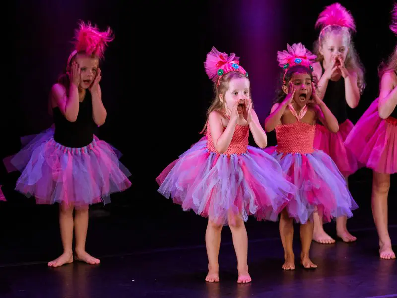 young group of ballet dancers on stage