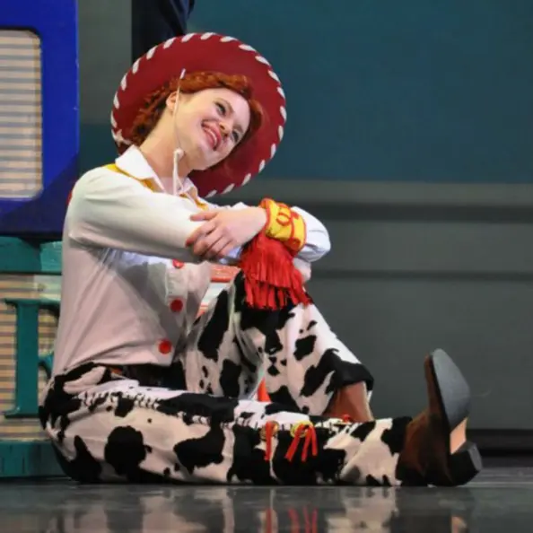 woman acting as a cowgirl from toy story