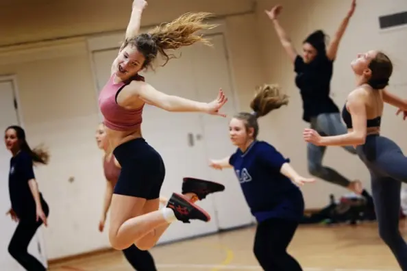 girls jumping in class and having fun