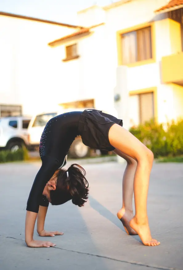 girl doing gymnastics in the road