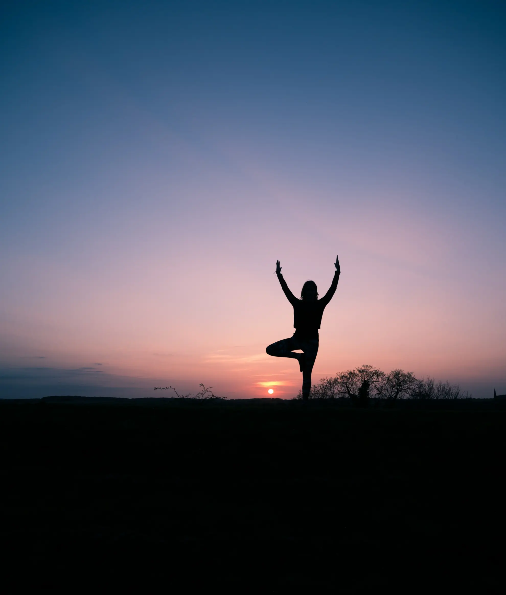 sunset of a woman doing a young pose